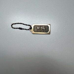 Vintage gold Coach Hang tag wirh horse and carriage